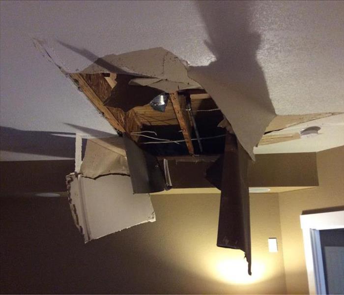 Ceiling that caved in due to a water leak.